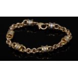 A contemporary gold and diamond fancy link bracelet,