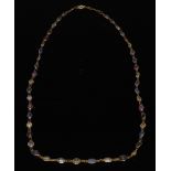 A multicoloured sapphire necklace, graduating irregular oval and round blue, yellow, red,