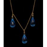 A blue topaz and diamond necklace, three individually suspended briolette cut blue topaz drops,