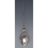 A 17th/18th century silver spoon, pointed 'mote' stem, the bowl chased with a stylised flower,
