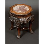 A Chinese padouk wood octagonal jardiniere stand, inset marble top,