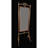 A late 19th century French brass tailor's cheval mirror,
