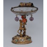 An Austrian silver-gilt and rock crystal salt, as a monkey climbing a tree,