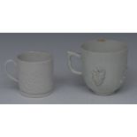 A Bow Blanc de Chine coffee cup, applied in relief with blossoming prunus, 7.5cm high, c.