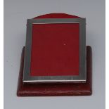 An unusual Edwardian silver mounted red morroco combination photograph frame and desk clip,