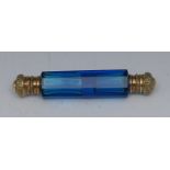 A Victorian blue glass double-ended scent bottle, hinged covers chased with scrolling foliage, 14.