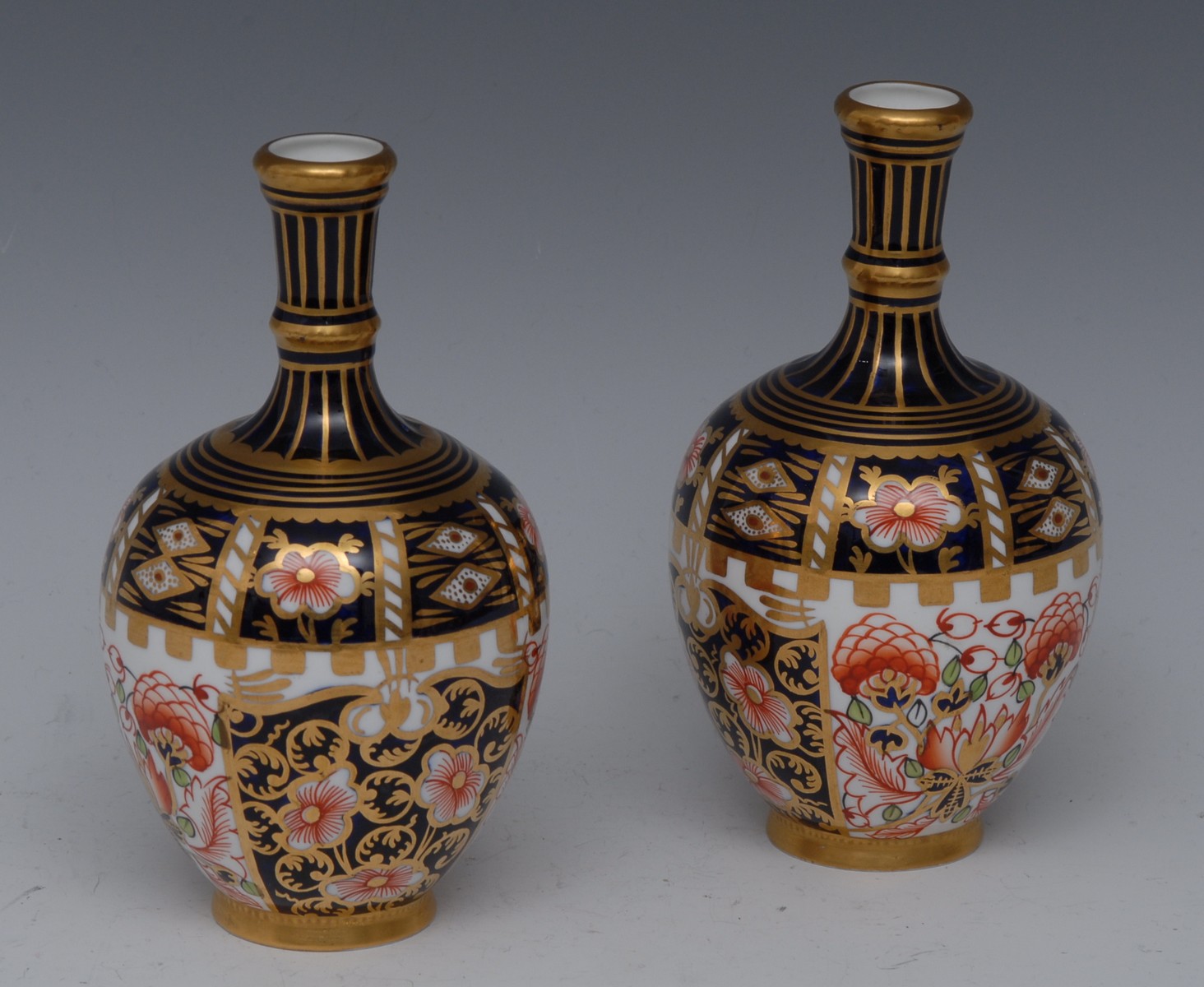 A pair of Royal Crown Derby 6299 pattern ovoid vases, long fluted necks, 14cm high, printed mark,