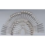 A comprehensive silver Kings Pattern table service, for twelve, comprising table spoons,