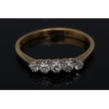 A lady's five stone diamond ring, linear set with five round brilliant cut diamonds,