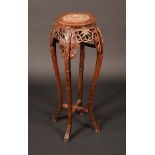 A Chinese padouk wood jardinere stand, inset marble top,