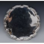 A George III shaped circular tray, 35.