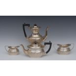 A composed Victorian silver four piece half fluted bachelor's tea and coffee service,