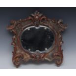 A 19th century gesso and painted cartouche shaped looking glass, carved with scrolling acanthus,