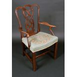 A George III mahogany elbow chair, shaped back and splat of intersecting curves,