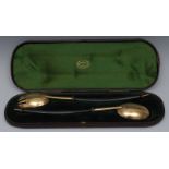 A pair of Victorian silver gilt salad servers, hardwood handles, George William Adams,