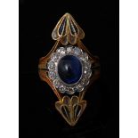 An Art Deco diamond, sapphire and enamel ring, central blue oval cabouchon sapphire,