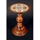 A 19th century yew pedestal occasional table, dished circular top, decorated with butterfly wings,