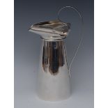 An tall Art Nouveau silver spreading cylindrical jug, everted wavy triform rim, lofty scroll handle,