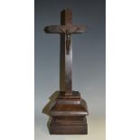 A 19th century bronze Corpus Christi, mahogany crucifix and base,