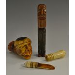 A 19th century Meerschaum pipe bowl, carved as the head of a grotesque man, 18.5cm long, c.