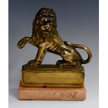 A 19th century library model, of a lion passant guardant, glass eyes, rose marble base,