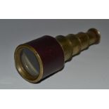 A 19th century brass four-drawer pocket monocular, morocco bound, extending to 12cm, c.