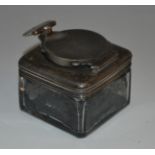 A George/William IV silver mounted glass travelling inkwell, hinged cover secured by a screw thread,