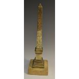 A 19th century Grand Tour bronze desk model, of an obelisk, engraved with hieroglyphics,