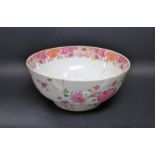 A large Chinese Famille Rose bowl, with faults and early restorations, 31cm diam,