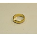 An 18ct gold wedding band 5.