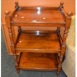 A Victorian mahogany three tier buffet, turned supports.c.