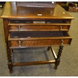 An oak cutlery cabinet on barley twist supports, brass drop handles, c.1930.