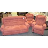 A contemporary three piece suite consisting of two recliners and a three seater settee.