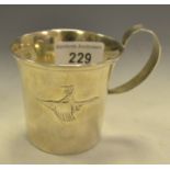 A Swedish Art Deco style silver mug, embossed with a figure riding on a goose,