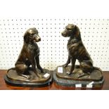 Continental school, 20th Century, a near pair of bronzed hounds, marble bases.