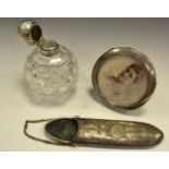 A silver spectacle case, Chester 1912; cut glass cologne bottle,