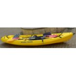 A Rotomod yellow kayak and paddles