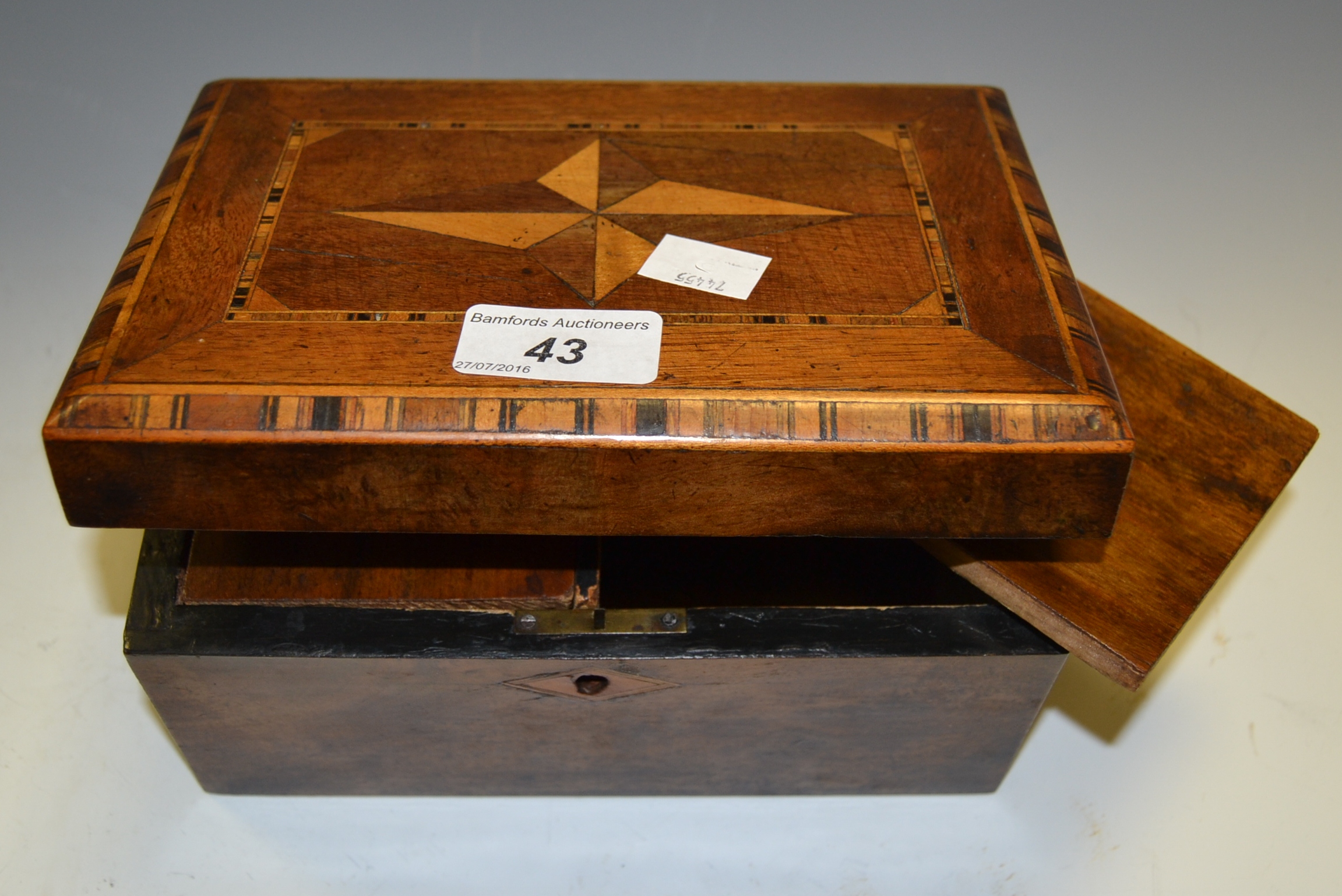 A Victorian marquetry rectangular tea caddy, hinged cover inlaid with four-pointed star,