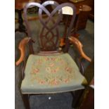 A George III mahogany elbow chair, shaped back and splat of intersecting curves,