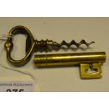 An unusual brass key corkscrew