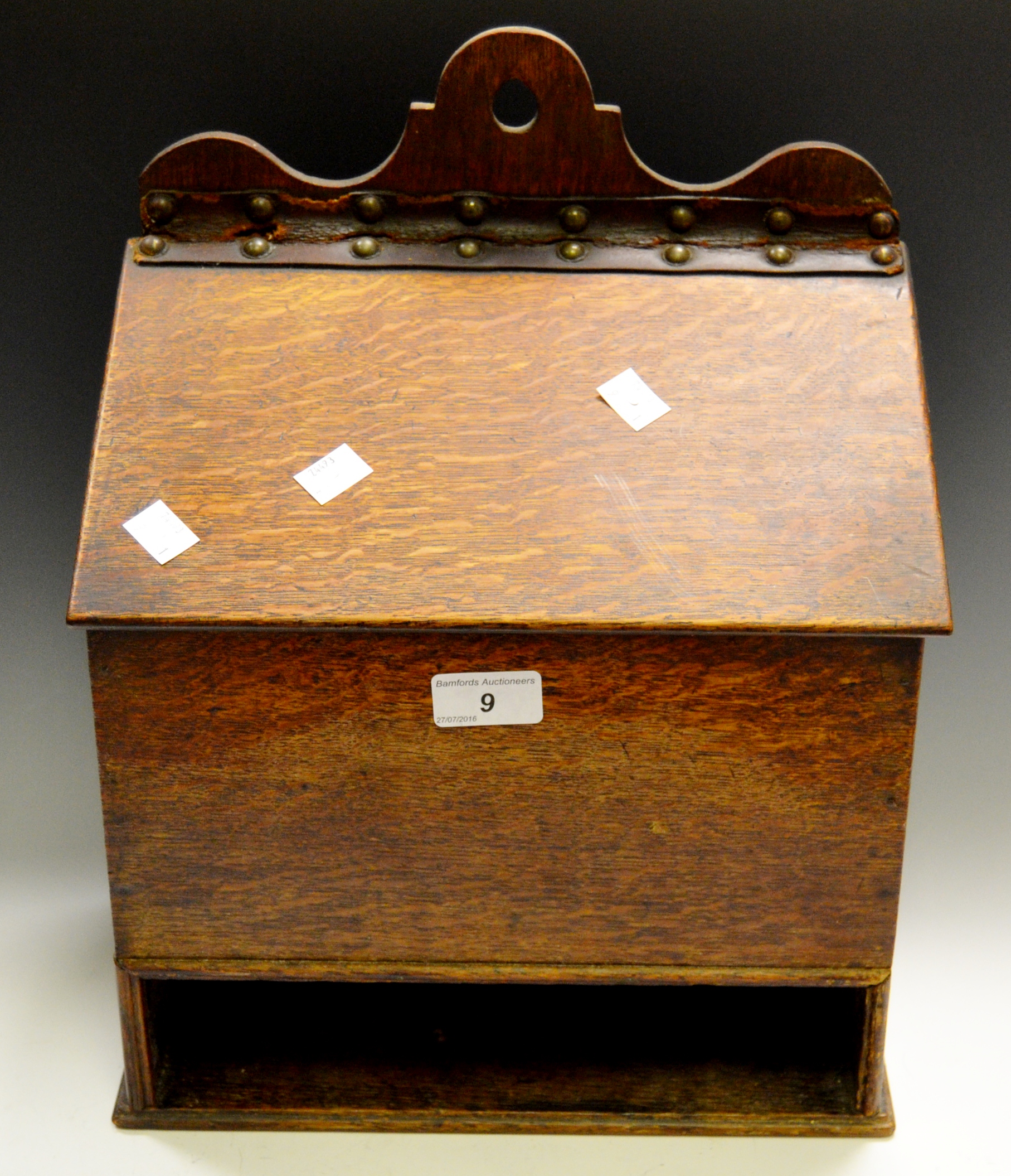 A 19th century oak candle box, pierced cresting with suspension loop,