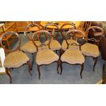 A harlequin set of seven Victorian balloon-back chairs, c.1890.