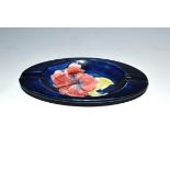 A Moorcroft Hibiscus pattern ashtray,