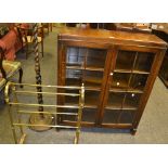 A 1930's oak glazed panel bookcase,