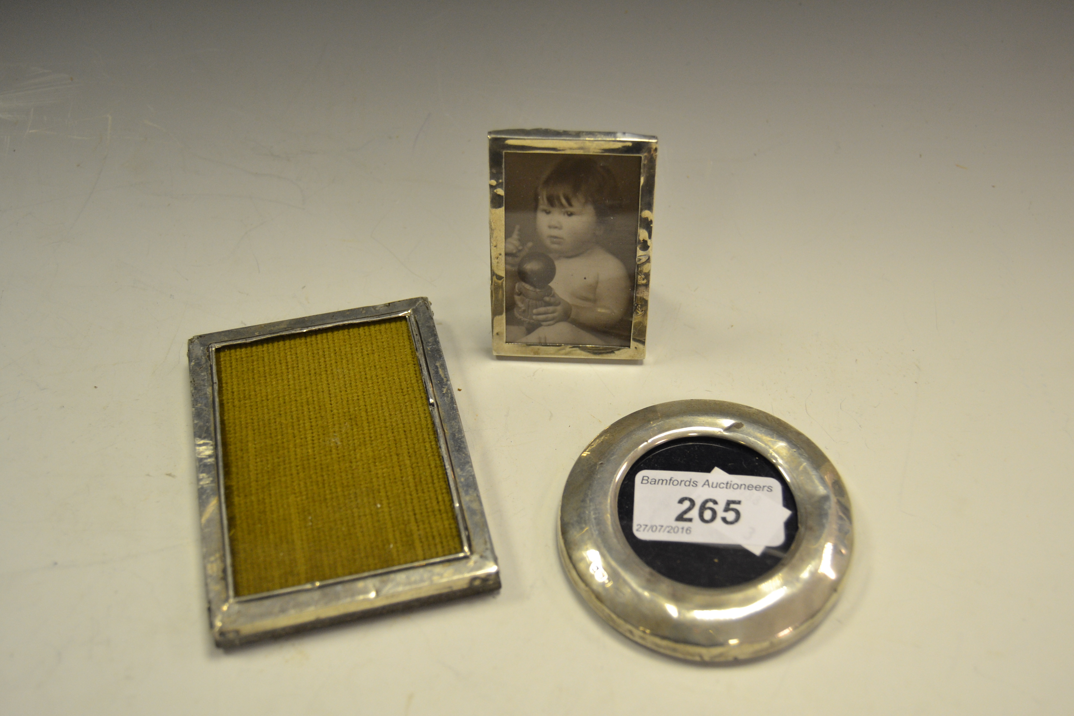 Three small silver photograph frames, London 1917, Birmingham 1918,