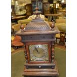 A late 19th century oak bracket clock,