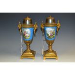 A pair of 19th century French porcelain and gilt metal urnular table lamp bases,