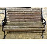 A cast iron and wooden garden bench