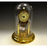 An early 20th century brass perpetual suspension timepiece, glass dome, c.