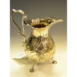 A Victorian bulbous jug, embossed with floral tendrils and scrolls, double scroll handle,